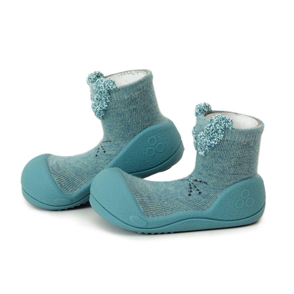 Meias Attipas Rabbit Mint, confortáveis e ideais para os primeiros passos dos bebés, promovendo o equilíbrio e liberdade de movimento.